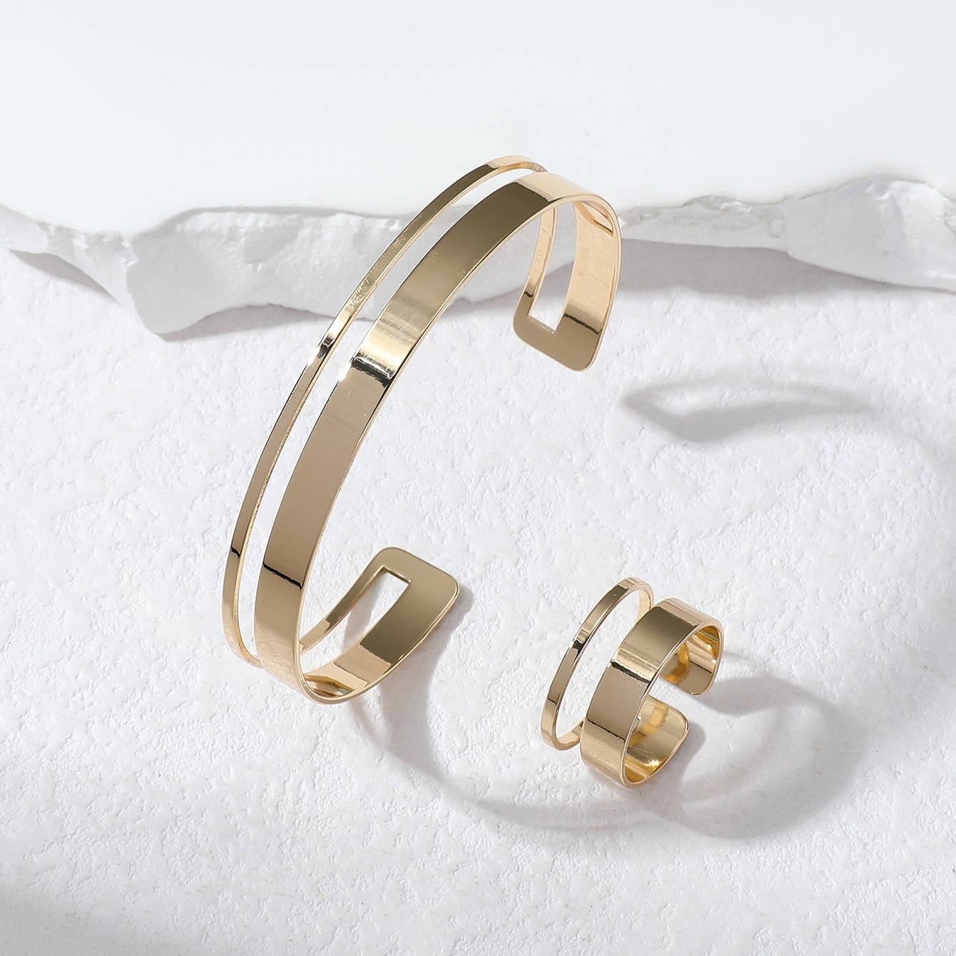 Set di semigioielli: bracciale e anello geometrico parallelo minimalista