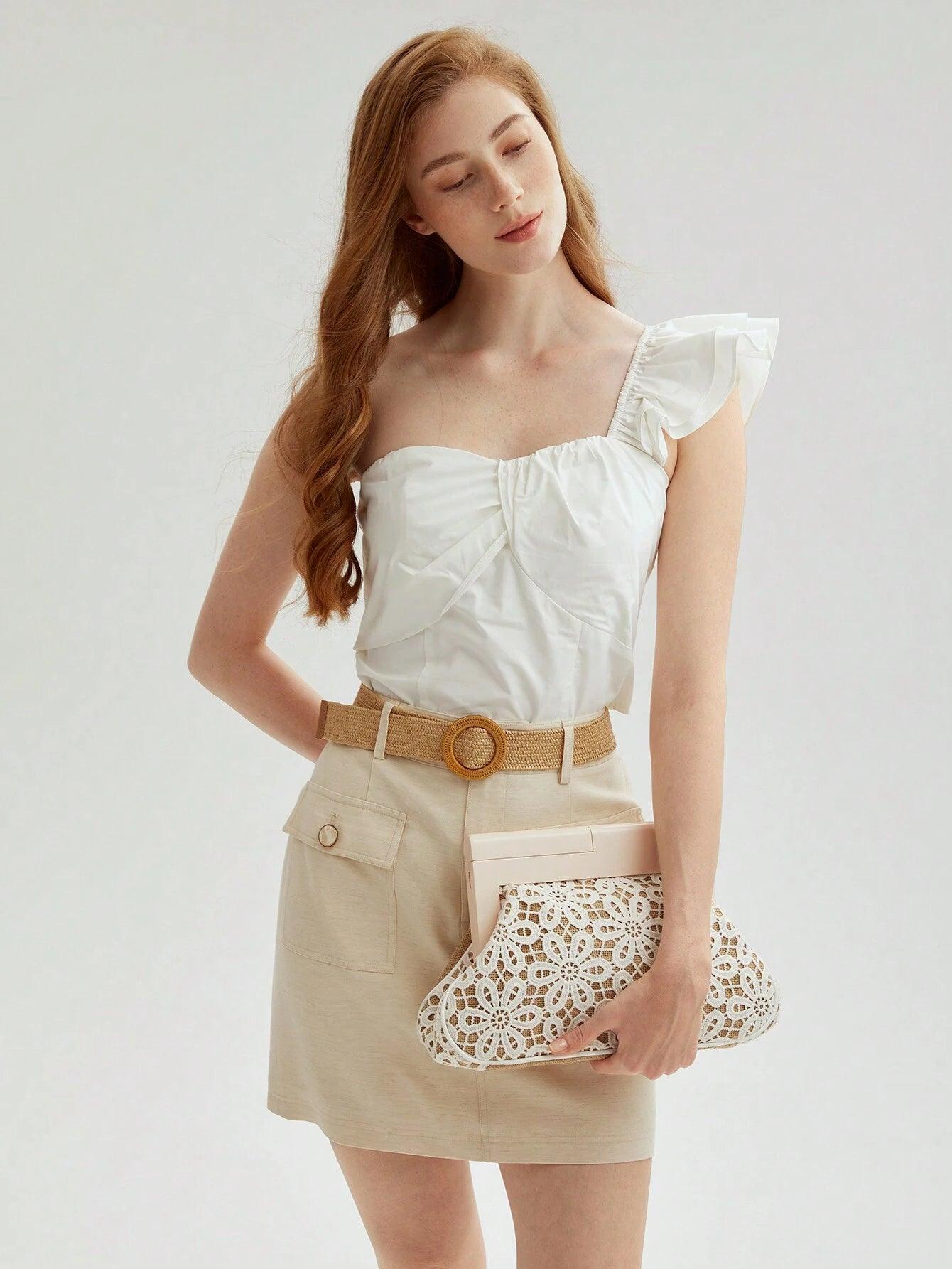 Clutch con design floreale intagliato “Carmela”