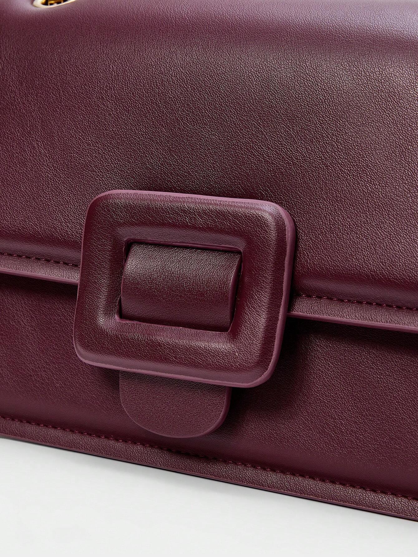 Borsa a tracolla con catena e fibbia “Stella”
